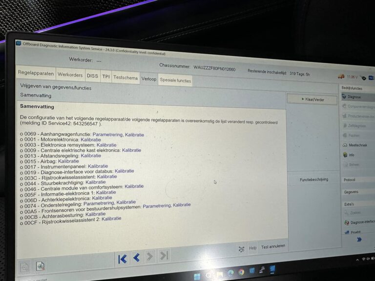 Technician installing Audi retrofit hardware on vehicle